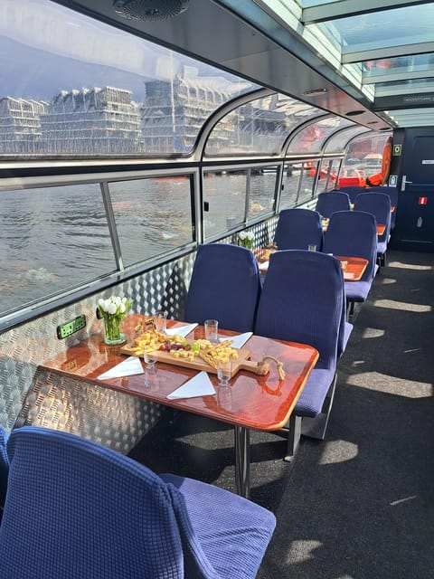 Amsterdam: Luxury Cheese & Wine Canal Cruise - A traditional boat with an important weather warning