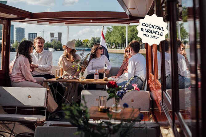 Amsterdam: Luxury Saloon Boat Cruise with Cocktails & Waffle - Seeing Amsterdam from a low open boat