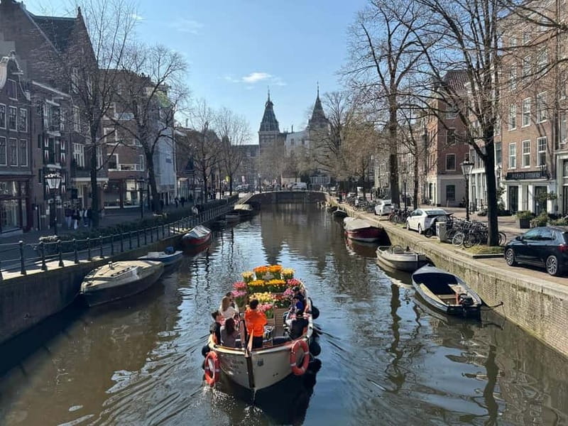 Amsterdam: Premium Tulip Boat Canal Tour - Leaving the dock with a small group