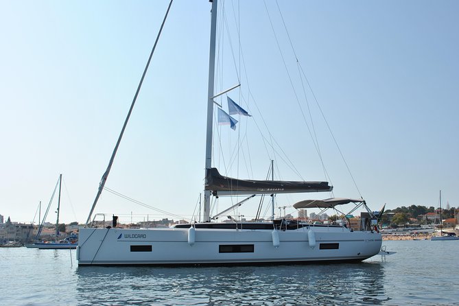 Cascais Private Luxury Sunset 2h Cruise with a drink - The lighthouse and the open coastal view