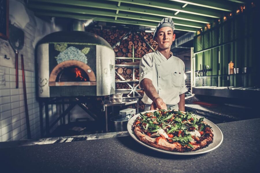 Como: Premium Pizza-Making Class at a Pizzeria - Taking your pizza to the wood-fired oven
