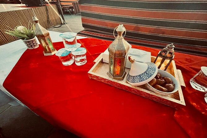 Deluxe Sunset Desert Safari: SandSurfing, Camel Ride & BBQ dinner - A Short Camel Ride and Falcon Photo