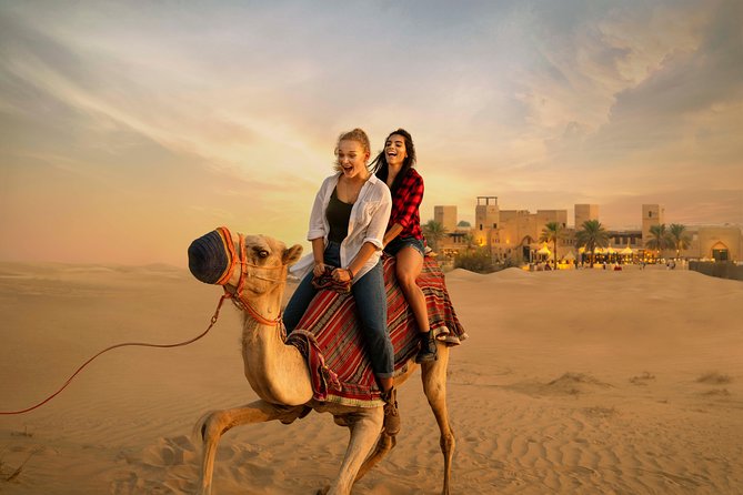 Desert Safari: Luxury Fortress Dinner, Camel Ride & Dune Bashing - Entering the illuminated desert fortress