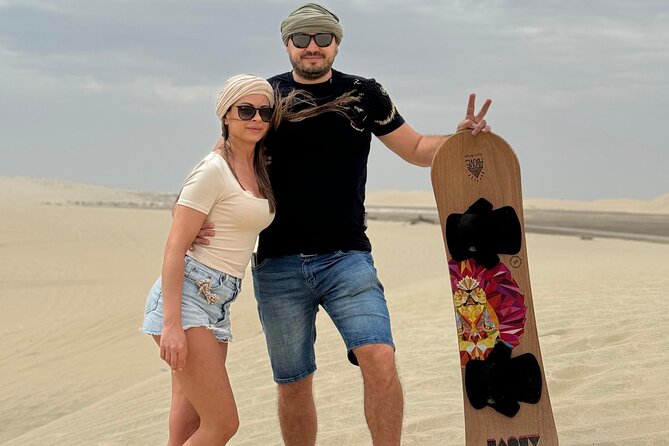 Doha: Luxury Desert Safari, Quad Bike & Sandboarding - Sandboarding from a high dune