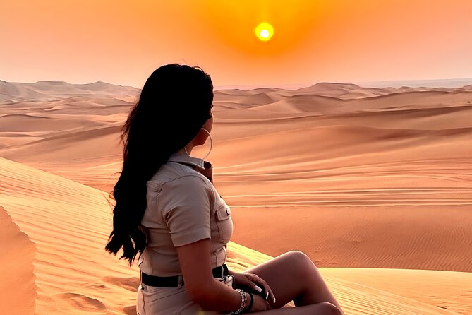 Dubai Desert Safari Premium Tour - Camel rides and a falcon photo at the camp