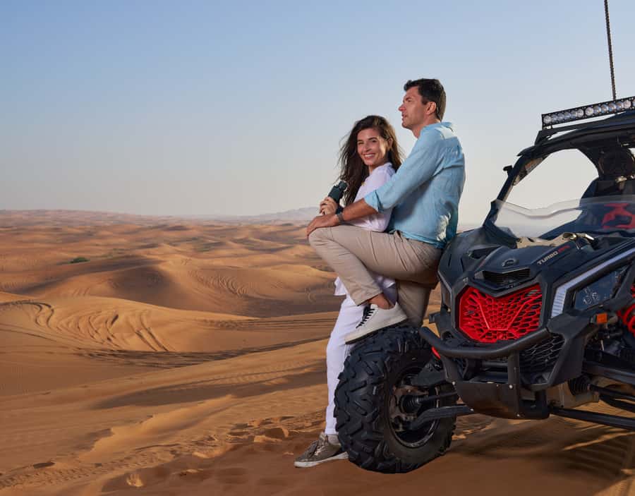 Dubai: Desert Safari, Quad Bike & Premium Camp Experience - Sandboarding, falcon photos, and camel time
