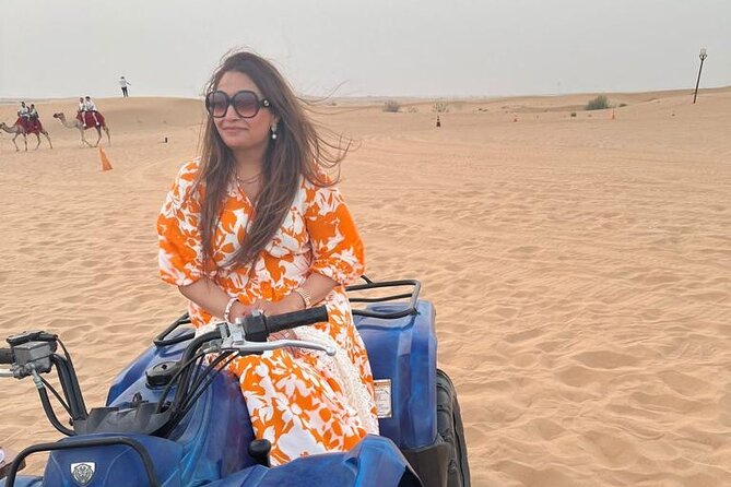 Dubai Evening Safari With Quad Biking VIP BBQ 10 Show Camel Ride - Quad biking across the sand