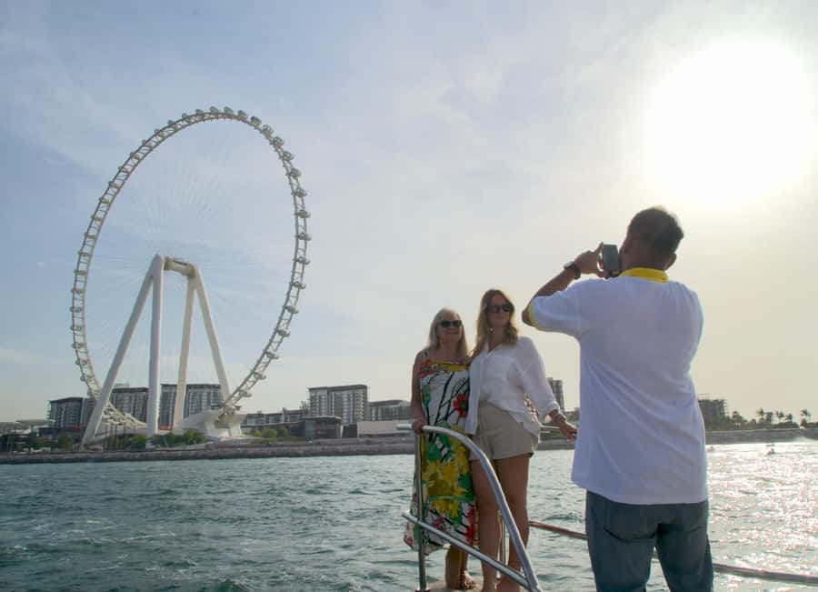 Dubai: Luxury Sunset Yacht Tour with Snacks and Drinks - The yacht, seating, and onboard mood