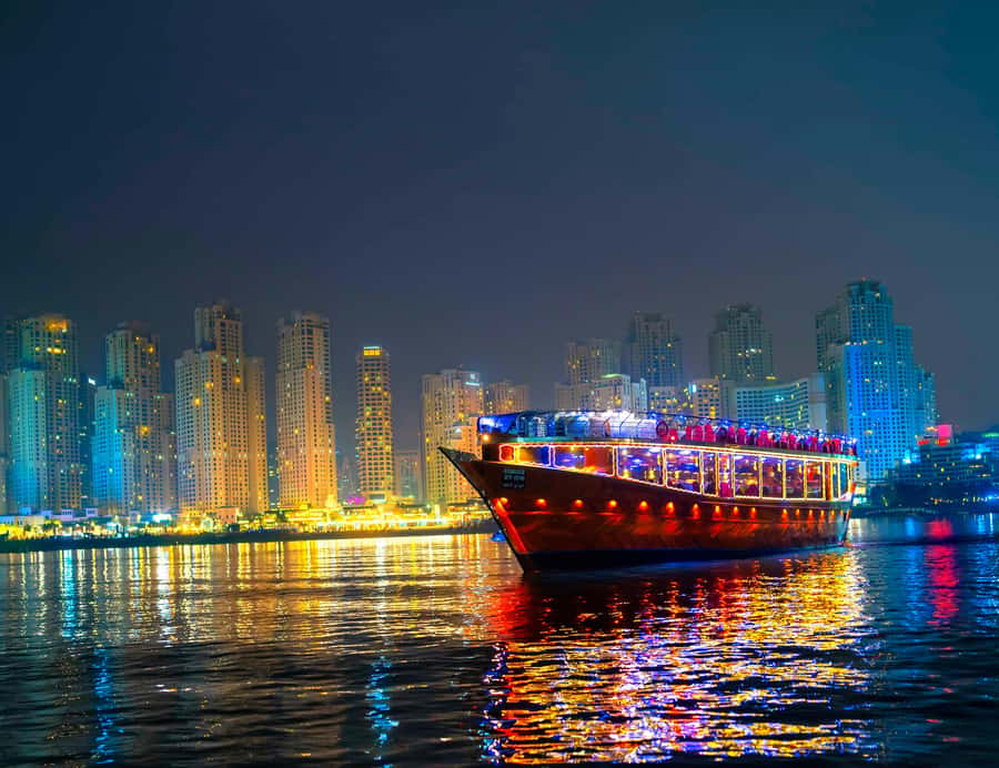 Dubai: Marina Luxury Dhow Dinner Cruise - Dubai Marina after dark, from an Arabian dhow