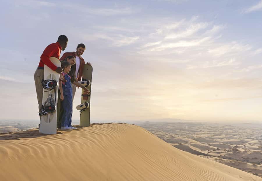 Dubai: Premium Desert Safari, Camel Ride, BBQ & Sandboarding - Camel ride, sandboarding, and henna
