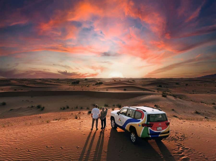 Dubai: Premium Desert Safari, Camel Ride, BBQ & Sandboarding - Dune bashing across Fort Lisaili