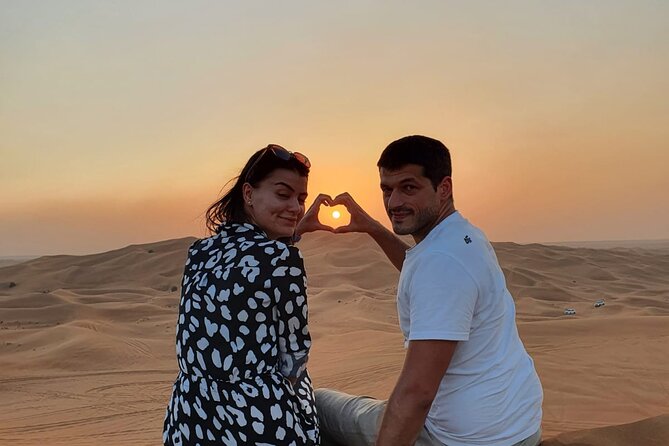 Dubai Premium Red Dunes Safari Camel Ride and BBQ Dinner - Sandboarding and sunset pictures on the red dunes