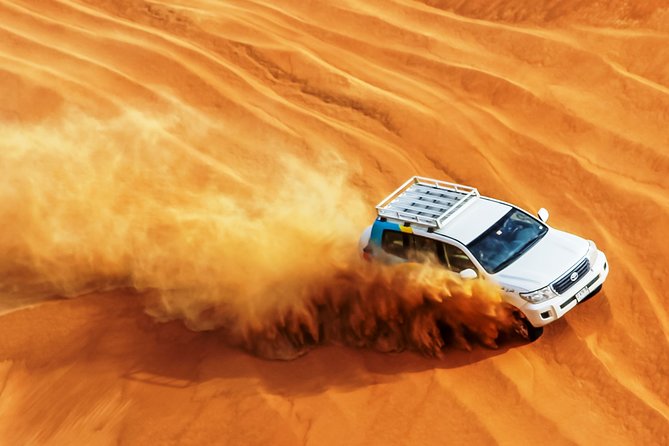 Dubai Private Premium Desert Safari with BBQ Dinner in 4WD - Sandboarding and sunset photographs