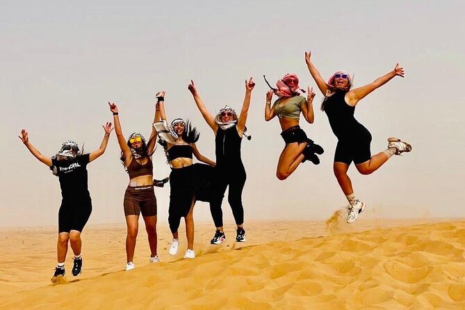 Dubai Red Dunes with Sandboarding, Camel Ride, Falcon & VIP Camp - Sunset, falcon photos, and a pause in the sand