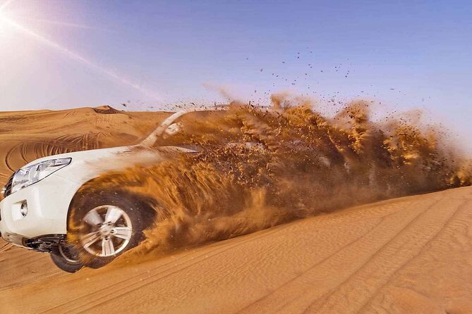 Evening Desert Safari Tour with Sand Surfing, BBQ Dinner (Exclusive Car) - Barbecue dinner, starters, and camp entertainment