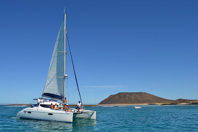 Exclusive Sailing Catamaran Experience to Lobos Island with lunch - Paella, fruit, and drinks on board