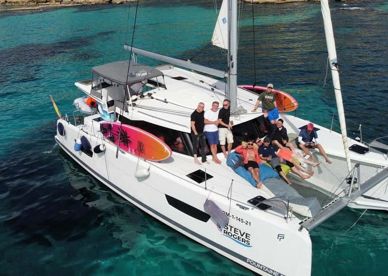 From Palma: Luxury Catamaran Group Tour with Tapas & Drinks - Crew service and the tone on board