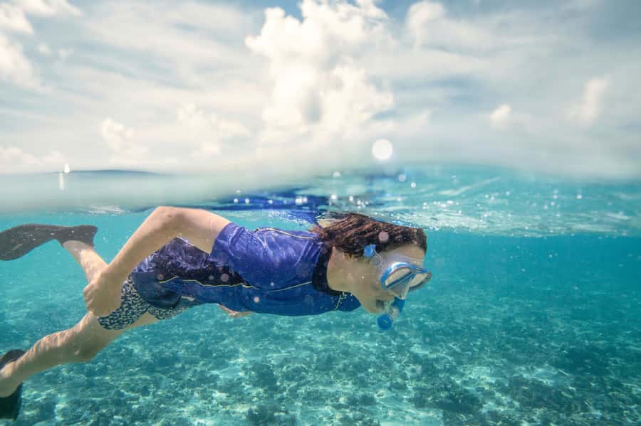 From Port Douglas: Outer Reef Cruise by Luxury Catamaran - Reaching the coral cay by glass-bottom boat