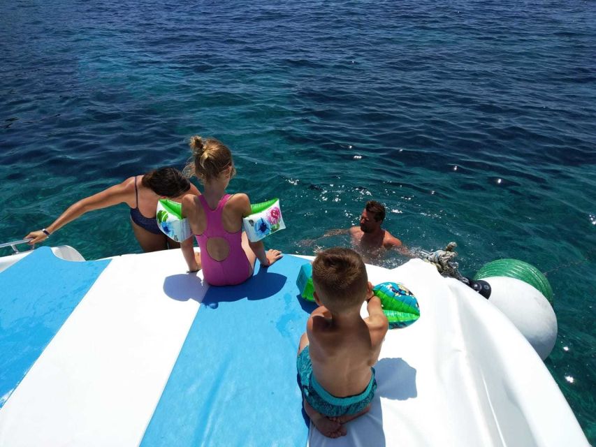 From Split: Luxury Cabin Boat Tour to The Blue Cave and Hvar - Stiniva Cove from the water