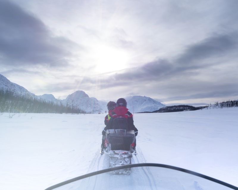From Tromso: Eco Luxury Snowmobile Adventure to Lyngen Alps - Riding quietly through the Lyngen Alps