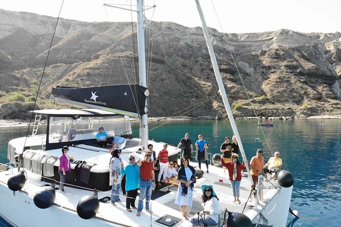 Half-Day Exclusive Catamaran Cruise in Santorini with Meal and Open Bar - Swimming near Santorini Volcano and the hot springs