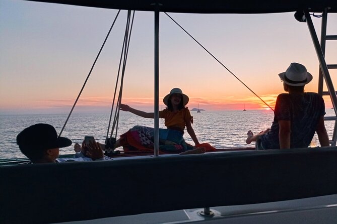 Half-Day Exclusive Catamaran Cruise in Santorini with Meal and Open Bar - The return past Fira and Black Mountain