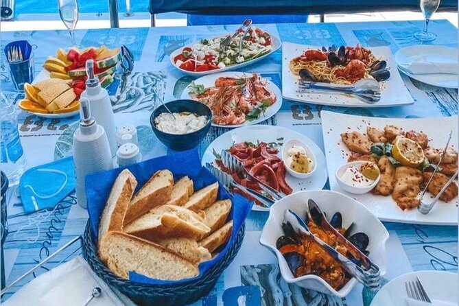 Half-Day Exclusive Catamaran Cruise in Santorini with Meal and Open Bar - The Venetian Lighthouse and the volcanic coast
