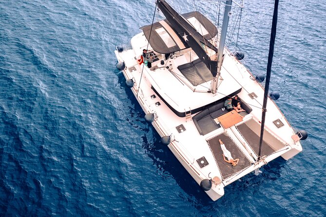 Half Day Premium Catamaran Cruise in Santorini including Oia - Red Beach begins the swimming rhythm