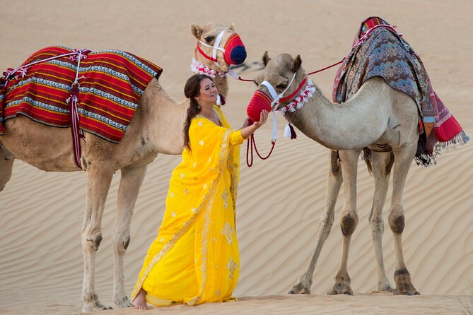 High Red Dunes with Camel Ride, Sandboarding, Falcon Show and VIP BBQ Dinner - Sandboarding on soft red sand
