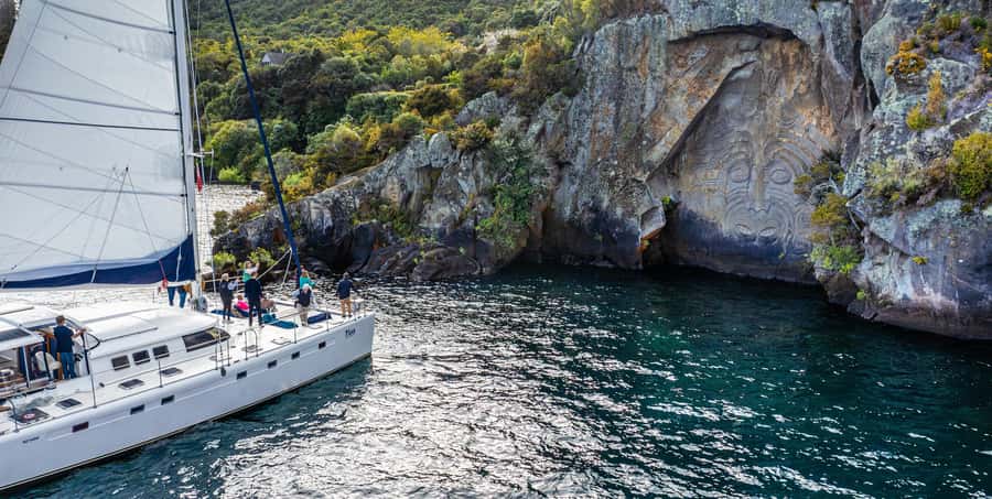 Lake Taupo: Luxury Sailing Catamaran to Māori Rock Carvings - The swim stop in fresh lake water