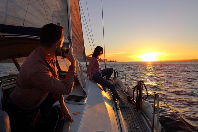 Lisbon Sunset Sailing Tour on Luxury Sailing Yacht with 2 Drinks - Passing under the 25 de Abril Bridge