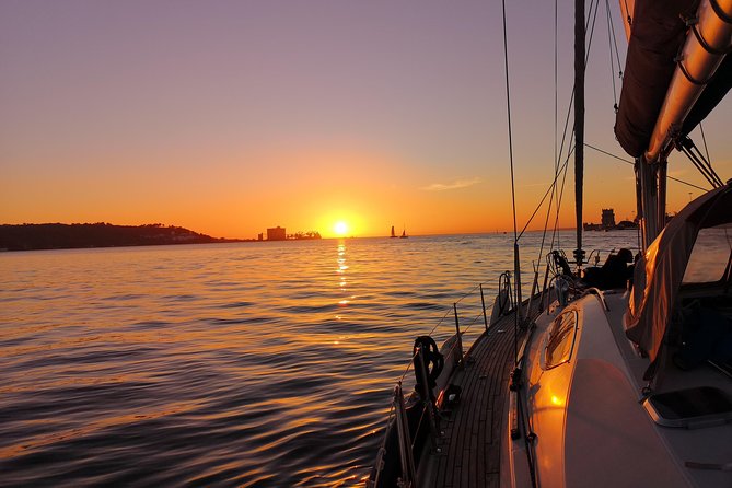 Lisbon Sunset Sailing Tour on Luxury Sailing Yacht with 2 Drinks - Lisbon’s hills and old neighborhoods from offshore