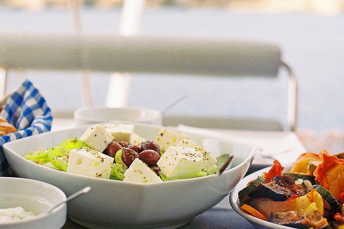 Luxury Catamaran Cruise from Athens with Traditional Greek Meal and BBQ - Boarding, welcome drink, and safety briefing