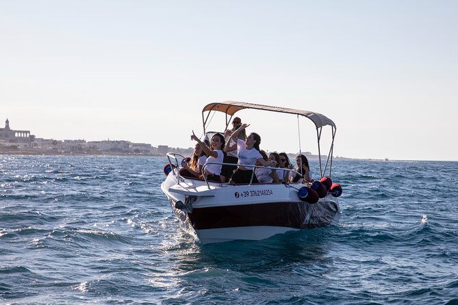 Luxury Shared Boat Tour in Polignano a Mare with Local Aperitif - Guides, stories, and the language question