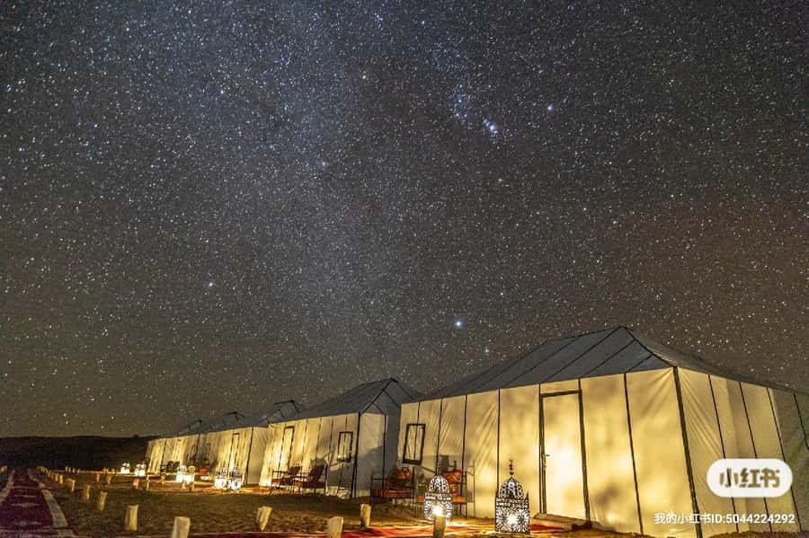 Merzouga: Overnight Stay in Luxury Desert Tent with Dinner - Moroccan dinner, tea, and the drum circle