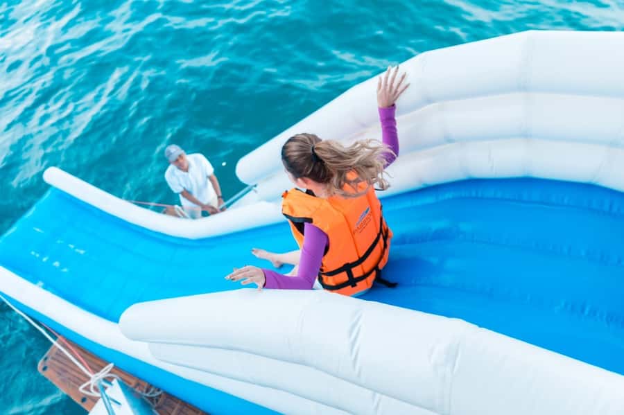 Phuket: James Bond Island Luxury Sunset Cruise - Swimming, the slide, and water hammocks at Yai Island
