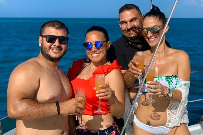Premium Catamaran Morning Sail: Snorkeling, Mimosas and Brunch - What the catamaran experience feels like between stops