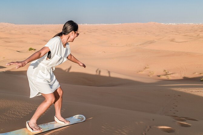 Premium Dubai Desert Safari with Dune Bashing, BBQ, Live Shows - Sandboarding and the brief camel ride