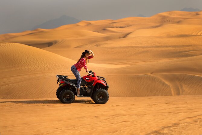 Premium Dubai Red Dunes with quadbike, camel ride and VIP Dinner - The 25-minute quad-bike session