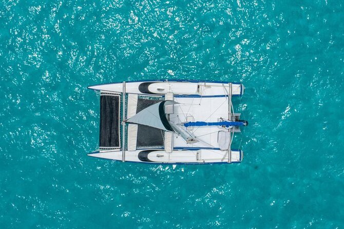 Premium Isla Mujeres Tour by Private Catamaran - The ride back with beer, rum, and tequila
