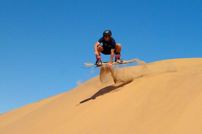 Premium Morning Dessert Safari With Quad Bike , Sand Boarding & Dune Bashing - Sandboarding is simple, sandy fun