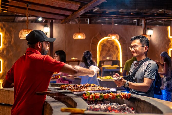 Premium Red Dune Safari with Camel Ride and BBQ in Arabian camp - Belly dancing, tanoura, and two fire shows