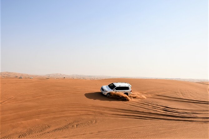 Premium Red Dunes Bashing with Quad Bike, Camel, Falcon &VIP Camp - Reaching Lahbab in an air-conditioned 4x4