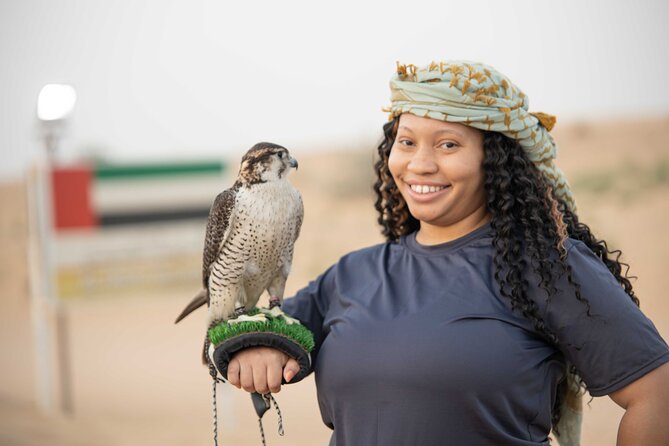 Premium Red Dunes Bashing with Quad Bike, Camel, Falcon &VIP Camp - Sandboarding on a 20-minute stop
