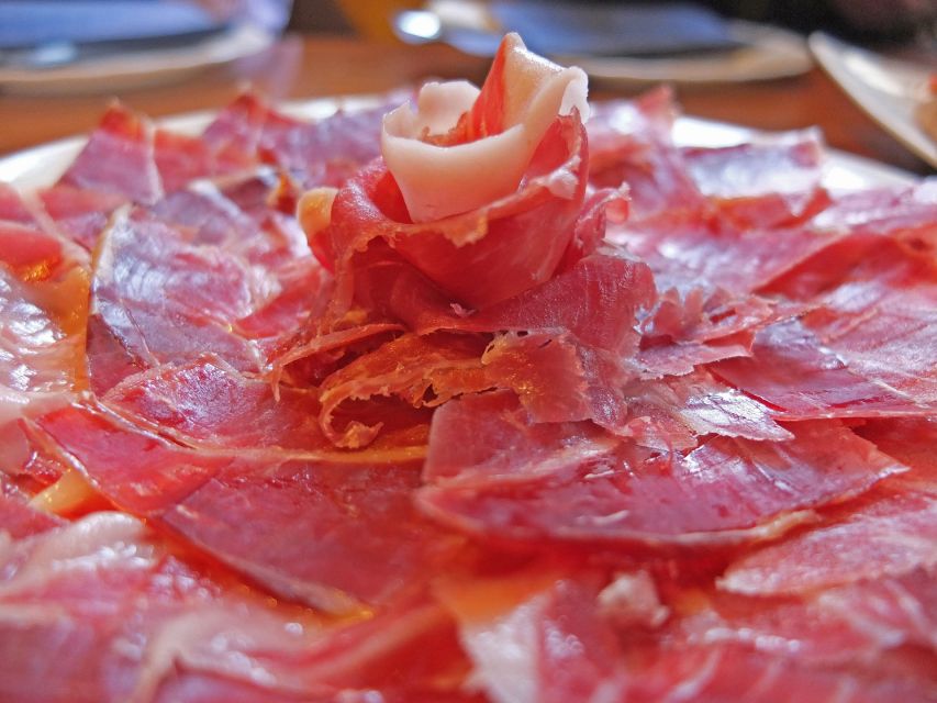 PREMIUM TAPAS TOUR: Paella, Market Tastings, and Winery - Paella, salad, and a drink near Málaga’s landmarks