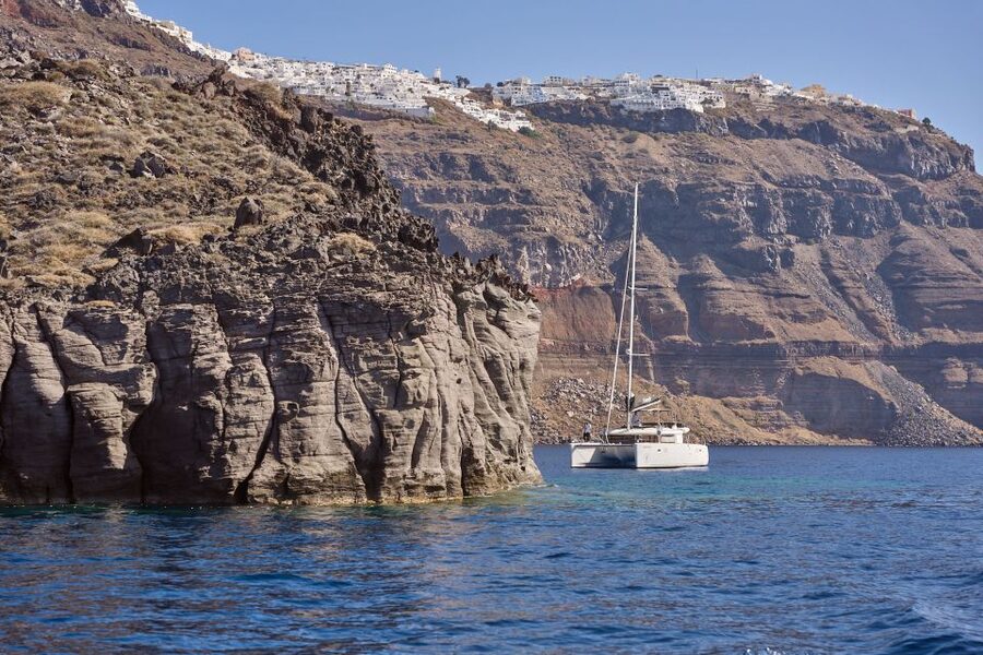 Santorini: Day Luxury Catamaran Cruise with Meal & Drinks - Black lava and Santorini’s volcanic islets