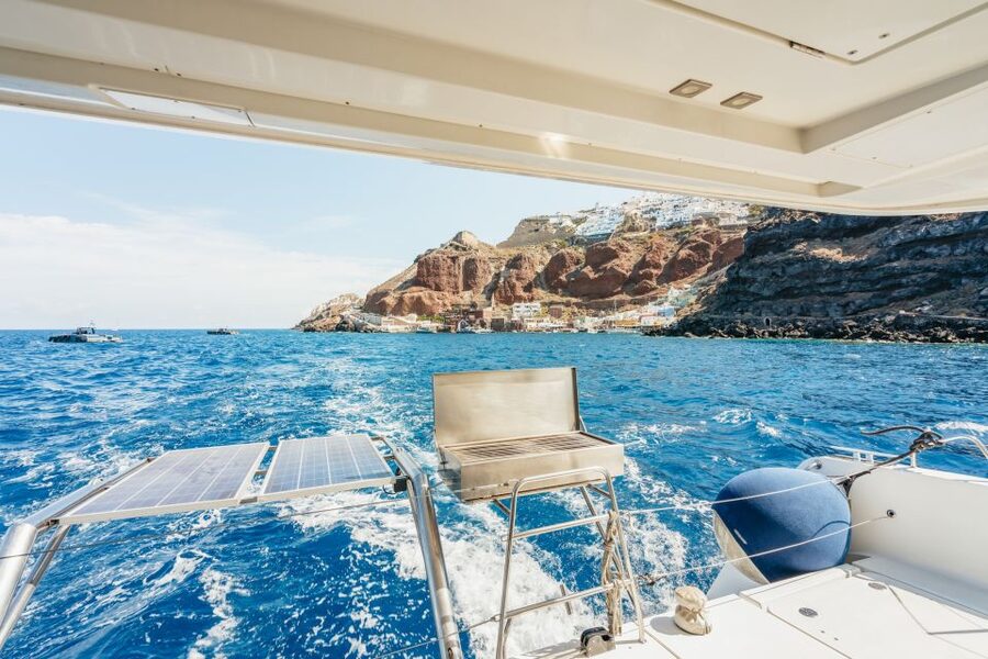 Santorini: Luxury Catamaran Day Trip with Meal and Open Bar - Sailing past Fira, the old port, and Oia