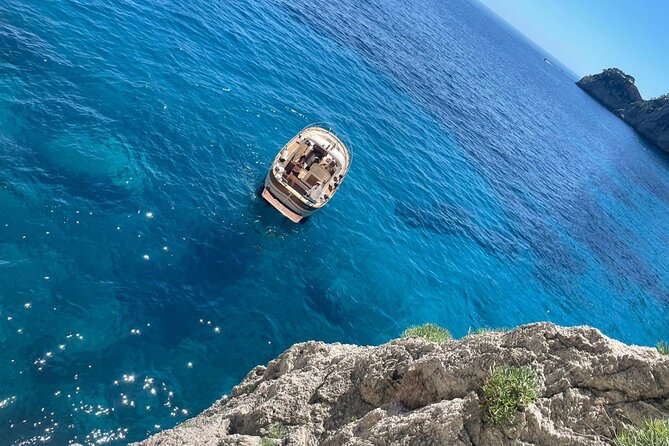 Three Hour Private Guided Tour of Capri with a luxury Gozzo cabin cruiser - Marina Piccola and the view of Capri’s high rollers
