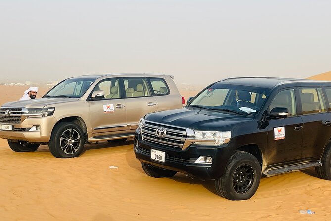 VIP Desert Safari with High Red Dune Bashing & Live BBQ Dinner - The Bedouin-style camp after dark