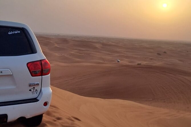 VIP Dubai Desert Safari with Quadbike,Sandboarding & BBQ dinner - Sandboarding and the best photo pause